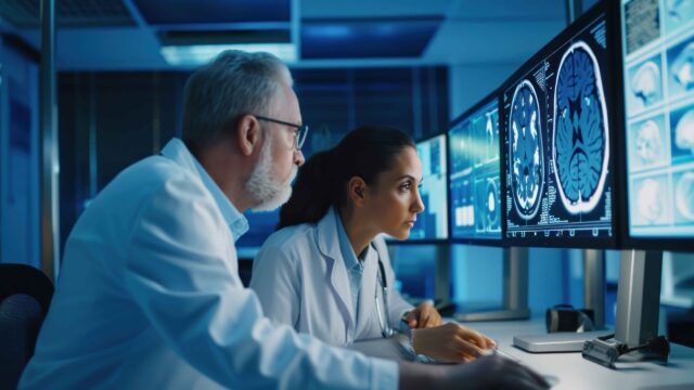 https://insights.waldenglobalservices.com/wp-content/uploads/2024/10/medical-researchers-looking-examining-brain-scan-computer-while-working-late-office-together-640x360.jpg